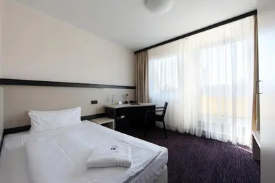 Ein Bett oder Betten in einem Zimmer der Unterkunft Dietrich-Bonhoeffer-Hotel Berlin Mitte