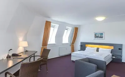 Ein Bett oder Betten in einem Zimmer der Unterkunft Dietrich-Bonhoeffer-Hotel Berlin Mitte