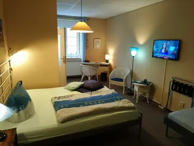 Ein Bett oder Betten in einem Zimmer der Unterkunft Hermanns Hotel Zum Goldenen Stern