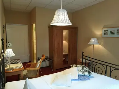 Ein Bett oder Betten in einem Zimmer der Unterkunft Hermanns Hotel Zum Goldenen Stern