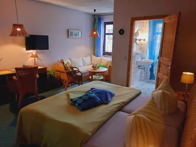 Ein Bett oder Betten in einem Zimmer der Unterkunft Hermanns Hotel Zum Goldenen Stern