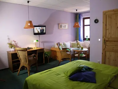 Ein Bett oder Betten in einem Zimmer der Unterkunft Hermanns Hotel Zum Goldenen Stern
