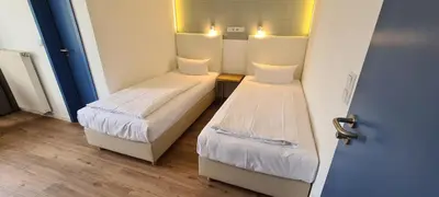 Ein Bett oder Betten in einem Zimmer der Unterkunft Hotel Spreeufer