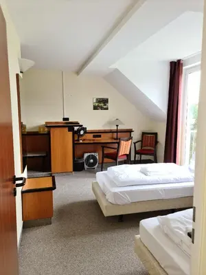 Ein Bett oder Betten in einem Zimmer der Unterkunft Landhotel Löwenbruch
