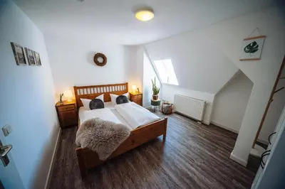 Ein Bett oder Betten in einem Zimmer der Unterkunft Apartmenthaus Kaiser Friedrich