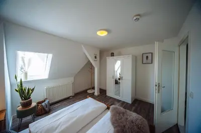 Ein Bett oder Betten in einem Zimmer der Unterkunft Apartmenthaus Kaiser Friedrich