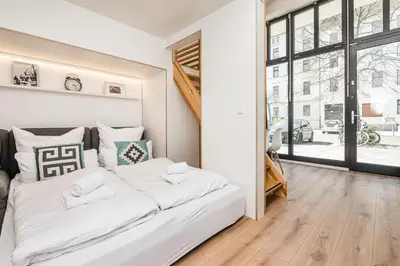 Ein Bett oder Betten in einem Zimmer der Unterkunft Stylish New Cube Loft by Berlin-Wall-Apartments