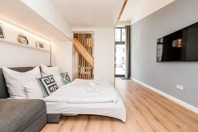 Ein Bett oder Betten in einem Zimmer der Unterkunft Stylish New Cube Loft by Berlin-Wall-Apartments