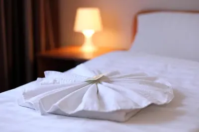 Ein Bett oder Betten in einem Zimmer der Unterkunft Hotel Elegia am Kurfürstendamm