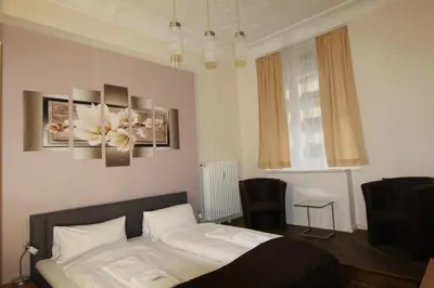 Ein Bett oder Betten in einem Zimmer der Unterkunft Hotel Elegia am Kurfürstendamm