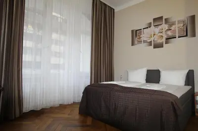Ein Bett oder Betten in einem Zimmer der Unterkunft Hotel Elegia am Kurfürstendamm