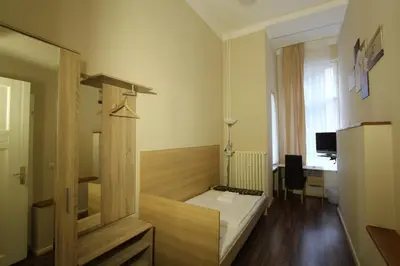 Ein Bett oder Betten in einem Zimmer der Unterkunft Hotel Elegia am Kurfürstendamm