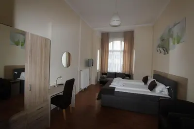 Ein Bett oder Betten in einem Zimmer der Unterkunft Hotel Elegia am Kurfürstendamm