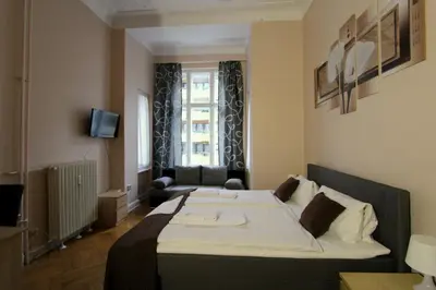 Ein Bett oder Betten in einem Zimmer der Unterkunft Hotel Elegia am Kurfürstendamm