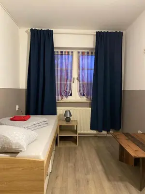 Ein Bett oder Betten in einem Zimmer der Unterkunft BOARDINGHOUSE ORANIENBURG