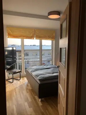 Ein Bett oder Betten in einem Zimmer der Unterkunft Stilvolle Ferien-Geschäftswohnung Brandenburger Seenlandschaft