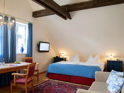 Ein Bett oder Betten in einem Zimmer der Unterkunft Landhaus Alte Schmiede