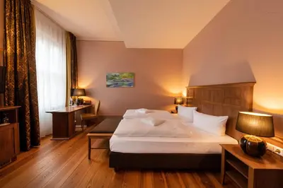 Ein Bett oder Betten in einem Zimmer der Unterkunft Hotel am Großen Waisenhaus