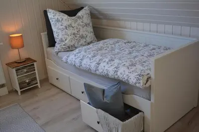 Ein Bett oder Betten in einem Zimmer der Unterkunft Kapitänshaus Zerpenschleuse Holiday Chalet