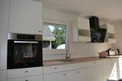 Küche/Küchenzeile in der Unterkunft Kapitänshaus Zerpenschleuse Holiday Chalet