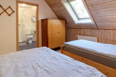Ein Bett oder Betten in einem Zimmer der Unterkunft Ferienwohnungen Behling am Schufutsberg