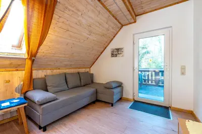 Ein Sitzbereich in der Unterkunft Ferienwohnungen Behling am Schufutsberg