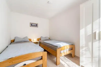 Ein Bett oder Betten in einem Zimmer der Unterkunft Ferienwohnungen Behling am Schufutsberg