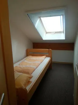 Ein Bett oder Betten in einem Zimmer der Unterkunft Ferienhof am Nationalpark