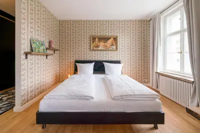 Ein Bett oder Betten in einem Zimmer der Unterkunft Design Apartments - 