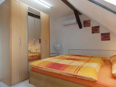 Ein Bett oder Betten in einem Zimmer der Unterkunft Ferienwohnung Mohnblume