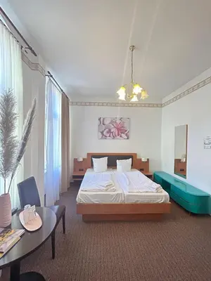 Ein Bett oder Betten in einem Zimmer der Unterkunft Hotel Adam