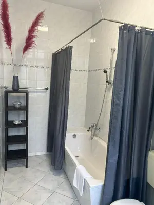 Ein Badezimmer in der Unterkunft Hotel Adam