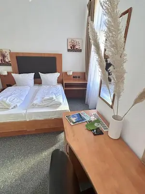 Ein Bett oder Betten in einem Zimmer der Unterkunft Hotel Adam