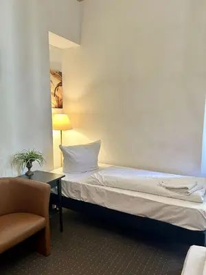 Ein Bett oder Betten in einem Zimmer der Unterkunft Hotel Adam