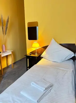 Ein Bett oder Betten in einem Zimmer der Unterkunft Hotel Adam