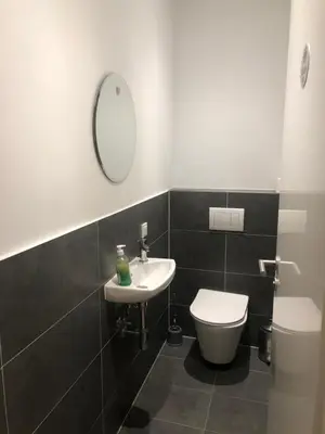 Ein Badezimmer in der Unterkunft Hotel Adam