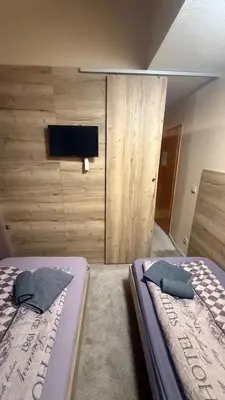 Ein Bett oder Betten in einem Zimmer der Unterkunft Hotel Pension Pamina