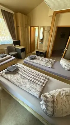 Ein Bett oder Betten in einem Zimmer der Unterkunft Hotel Pension Pamina