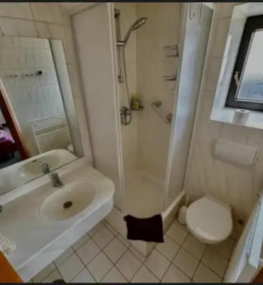 Ein Badezimmer in der Unterkunft Hotel Pension Pamina