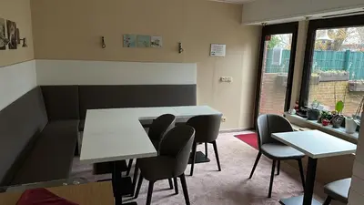Ein Sitzbereich in der Unterkunft Hotel Pension Pamina