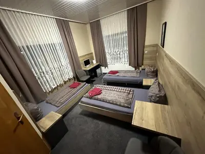 Ein Bett oder Betten in einem Zimmer der Unterkunft Hotel Pension Pamina