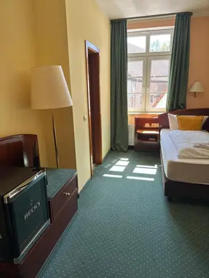 Ein Bett oder Betten in einem Zimmer der Unterkunft Hotel am Schloss - Frankfurt an der Oder