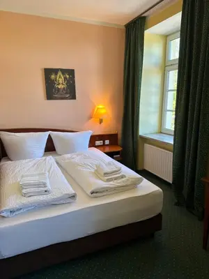 Ein Bett oder Betten in einem Zimmer der Unterkunft Hotel am Schloss - Frankfurt an der Oder