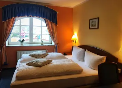 Ein Bett oder Betten in einem Zimmer der Unterkunft Hotel am Schloss - Frankfurt an der Oder