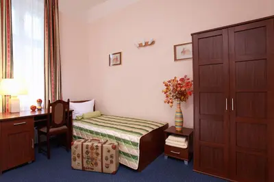 Ein Bett oder Betten in einem Zimmer der Unterkunft Hotel Central Inn am Hauptbahnhof Pension