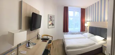 Ein Bett oder Betten in einem Zimmer der Unterkunft Hotel Hansablick