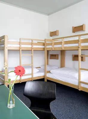 Ein Bett oder Betten in einem Zimmer der Unterkunft Jugendgästehaus des CVJM Berlin-Kaulsdorf