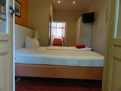 Ein Bett oder Betten in einem Zimmer der Unterkunft Pension Zeitlos