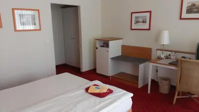 Ein Bett oder Betten in einem Zimmer der Unterkunft Pension Zeitlos