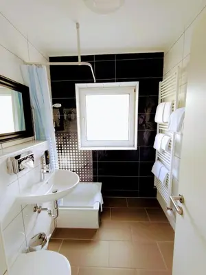 Ein Badezimmer in der Unterkunft Les Nations